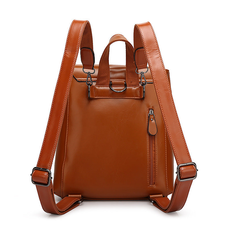 Brown leather backpack on a white background