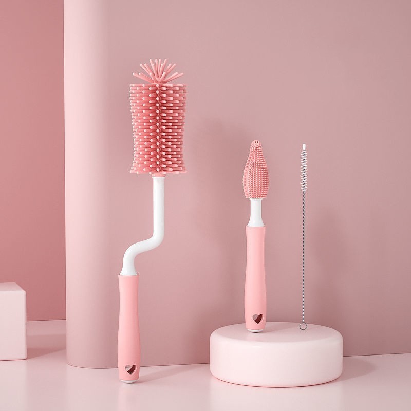 Set of pink bottle brushes on a pink background